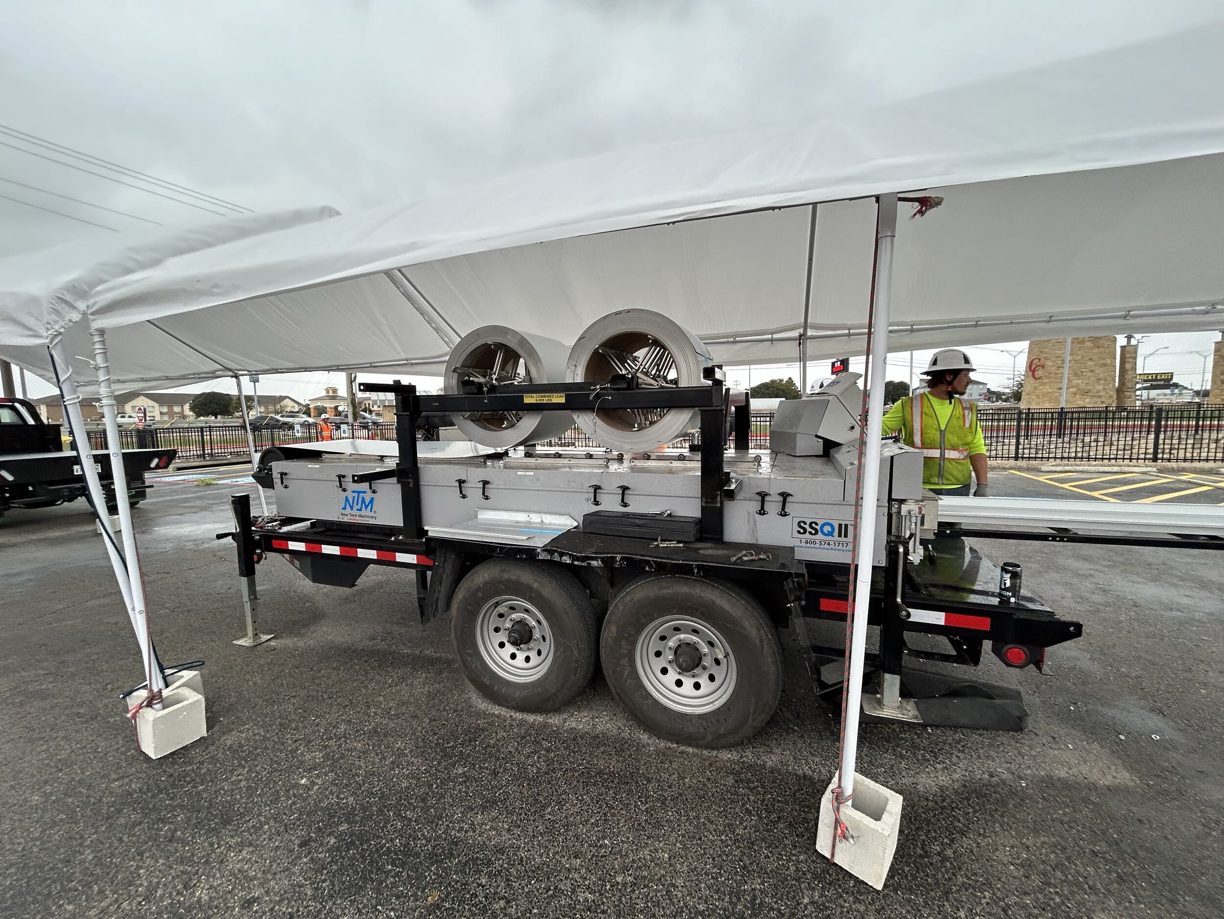 On-site roll forming equipment forming metal roof panels